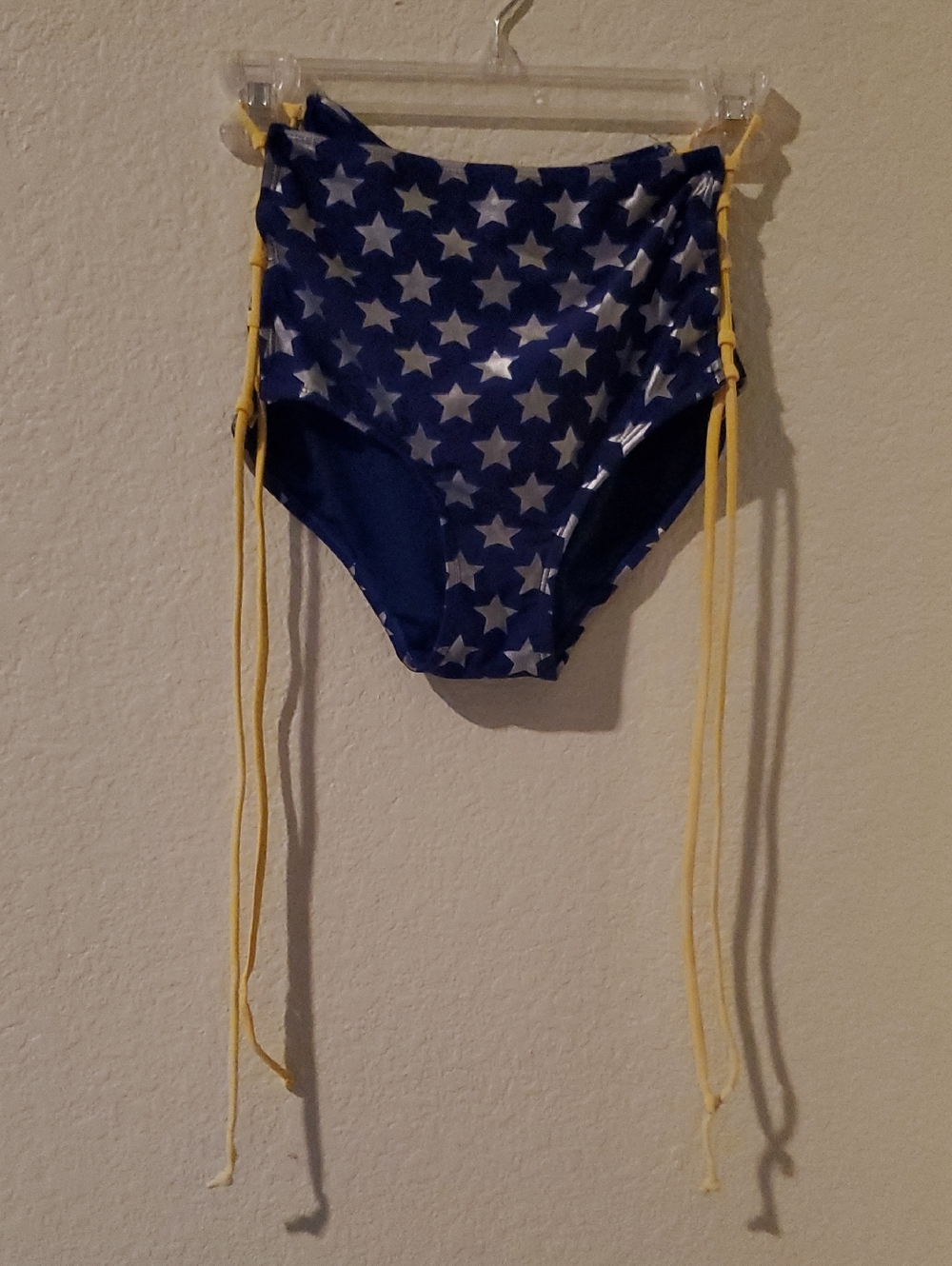 Wonder Woman Blue Swim Bottom with Silver Stars and Yellow Lace Up Sides